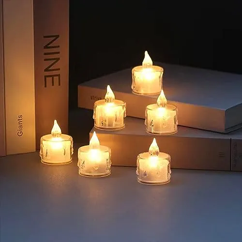 The Decor Affair 24PCS Enchanted Flameless Electric Candles: Flickering Tea Lights with Realistic Candlelight Effect, Perfect for Creating Magical Evenings.