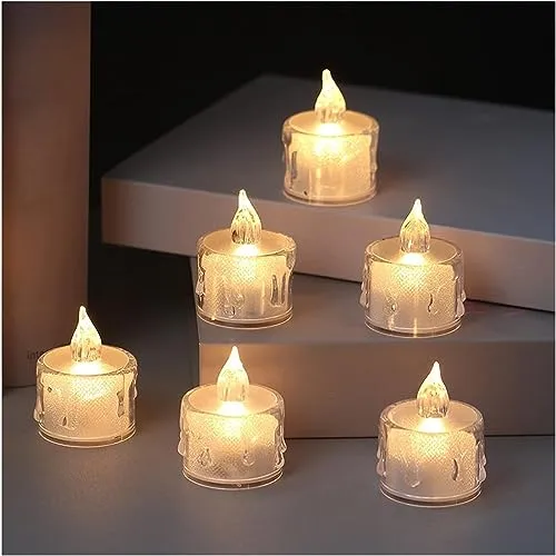 The Decor Affair 24PCS Enchanted Flameless Electric Candles: Flickering Tea Lights with Realistic Candlelight Effect, Perfect for Creating Magical Evenings.